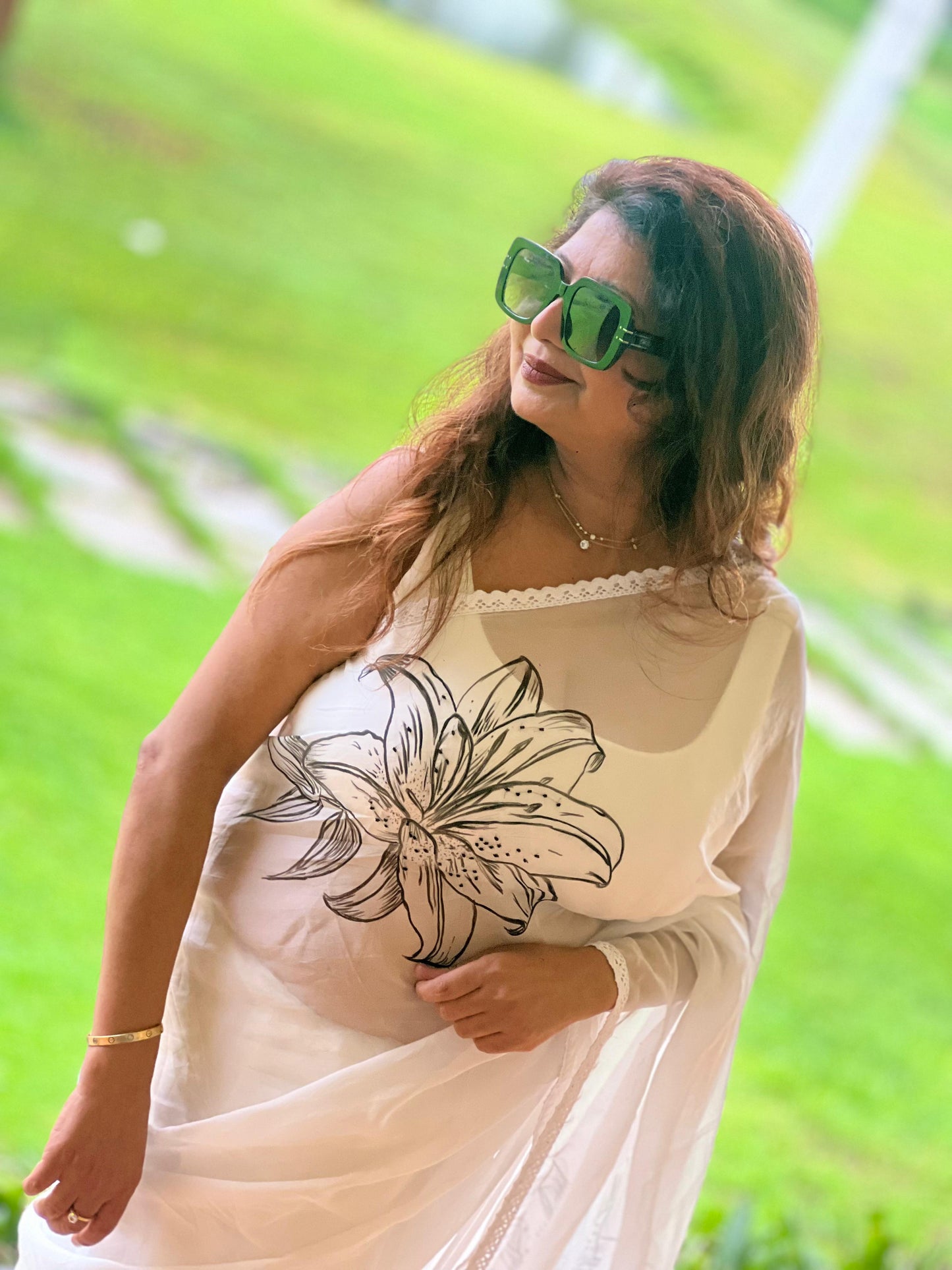 Hand painted and hand embroidered organza saree
