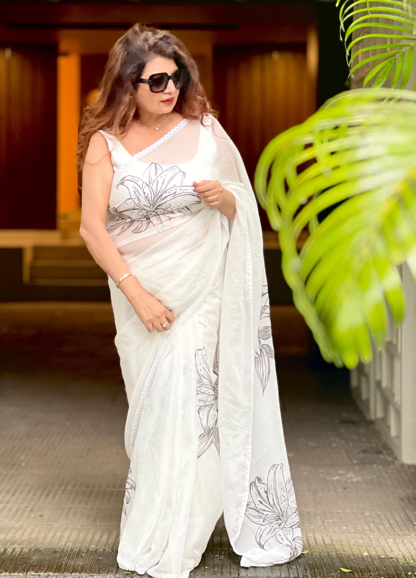 Hand painted and hand embroidered organza saree
